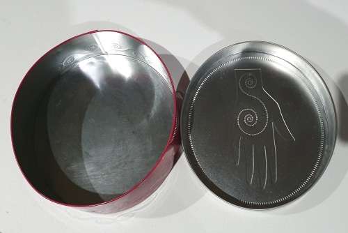 Red and silver tin as per photos