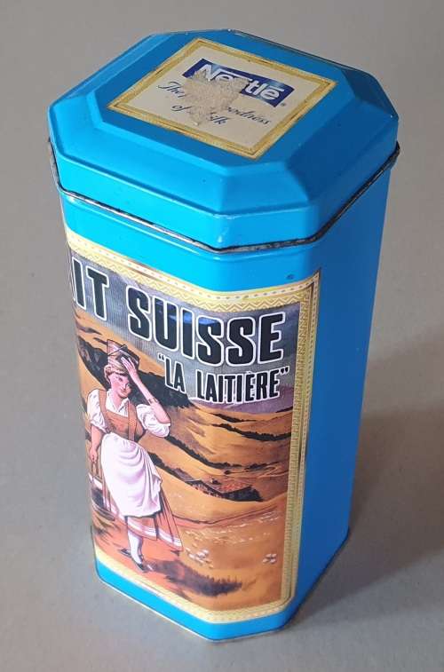 NESTLE tin as per photos