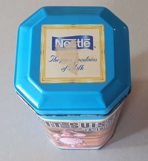 NESTLE tin as per photos