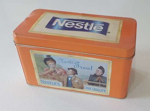 NESTLE tin as per photos