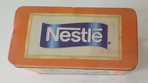 NESTLE tin as per photos