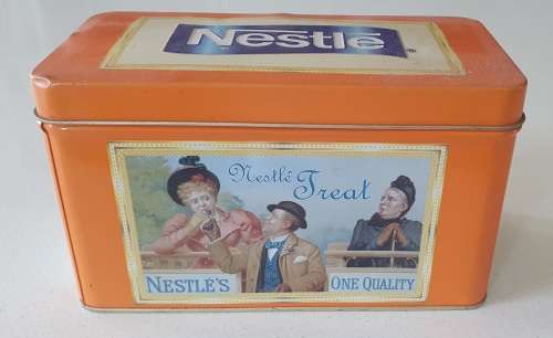 NESTLE tin as per photos