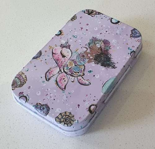 Small tin as per photos