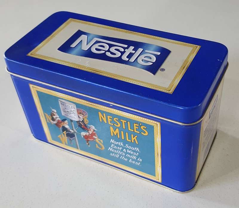 NESTLE milk tin as per photos