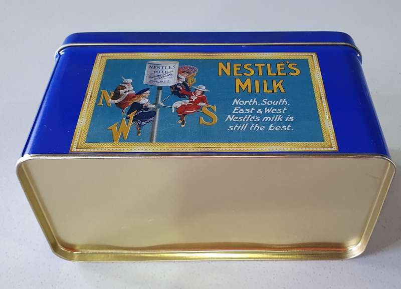 NESTLE milk tin as per photos
