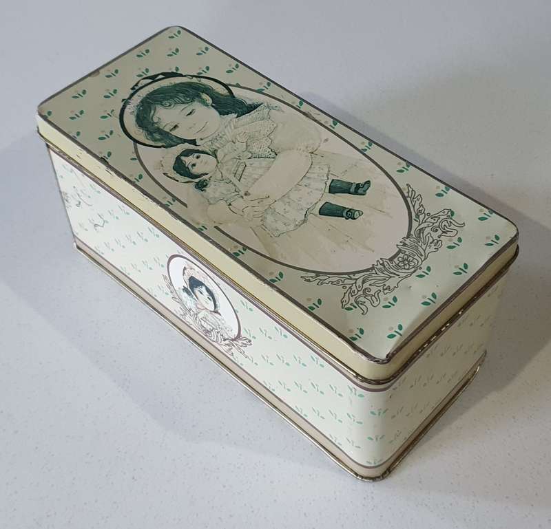 Vintage tin with  image of girl & doll as per photos