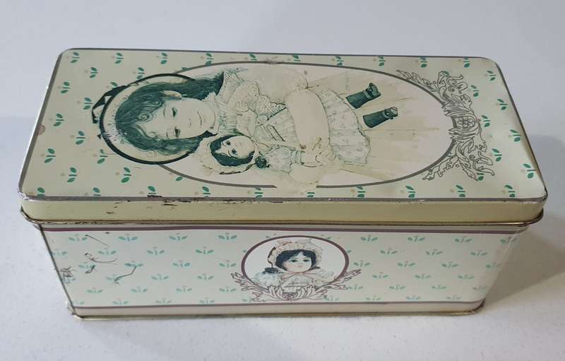 Vintage tin with  image of girl & doll as per photos