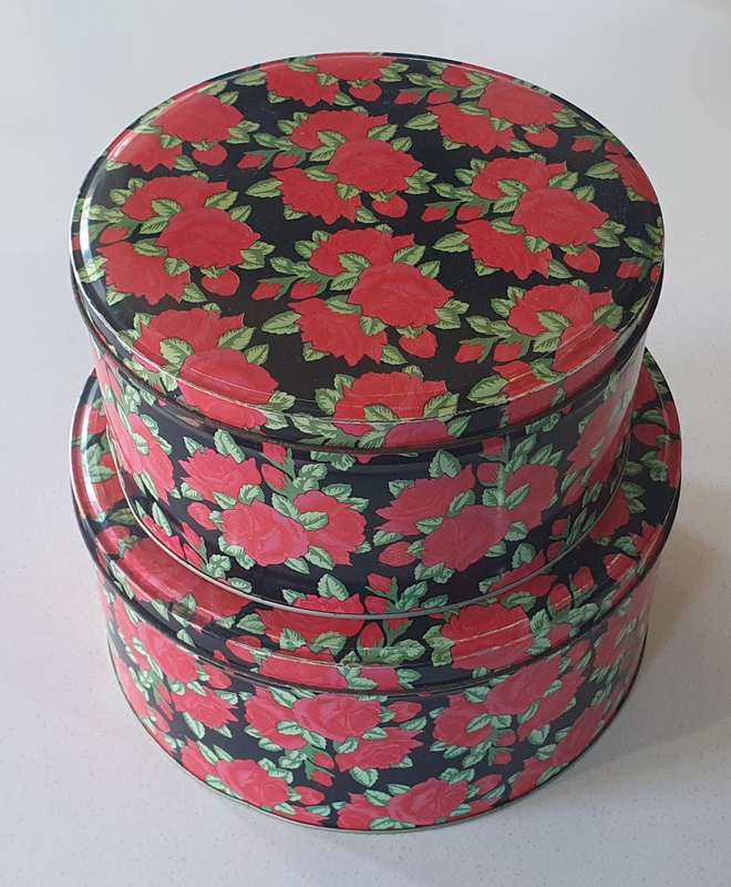 2 round biscuits tins as per photos