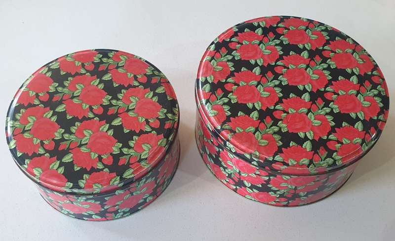 2 round biscuits tins as per photos