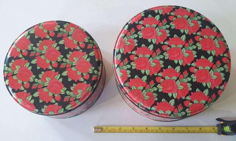 2 round biscuits tins as per photos