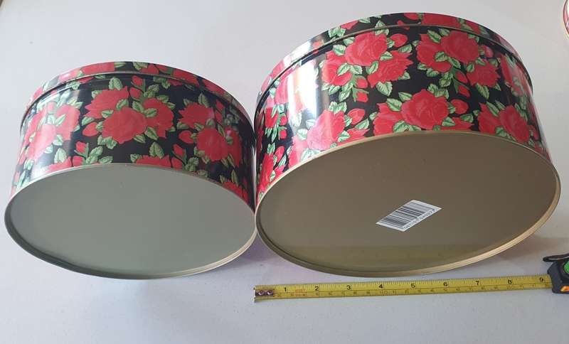 2 round biscuits tins as per photos