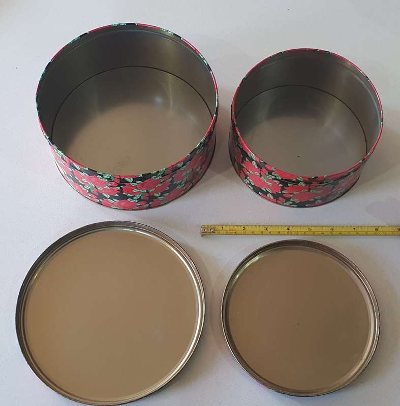 2 round biscuits tins as per photos