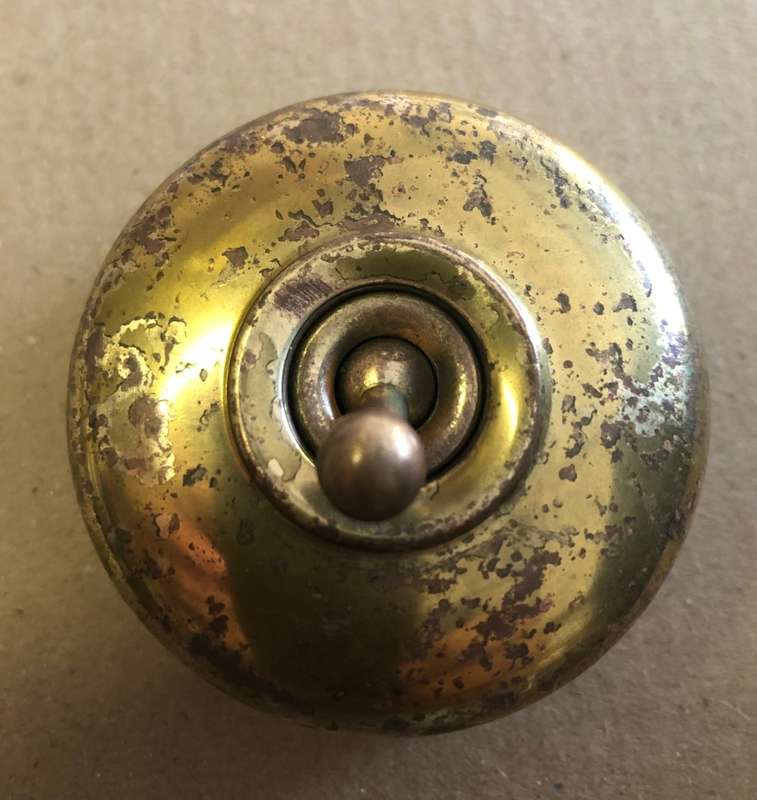 Crabtree porcelain and brass light switch