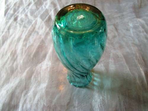 I HAVE SUCH A STUNNING GREEN GLASS VASE - REAL NICE PIECE!!!!