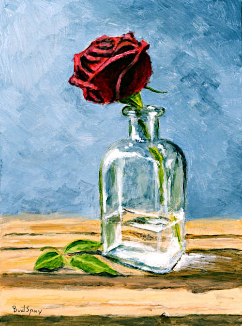 Rose in a glass bottle