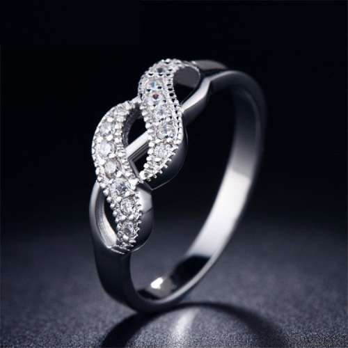 RADIANT! Cross Over Infinity Ring With 12 0,25ct Simulated Diamonds Size 7; 8  US