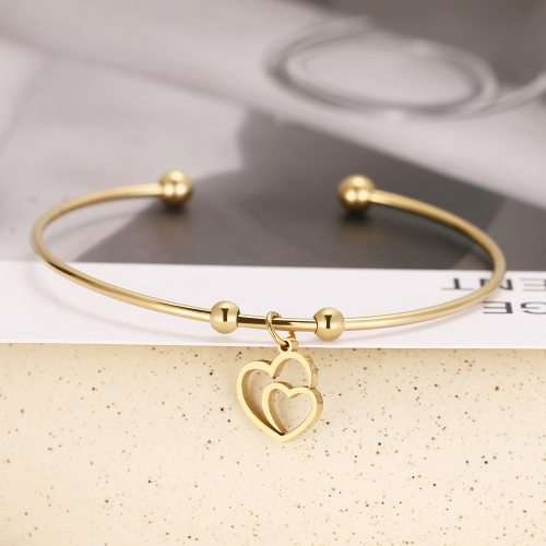 RETAIL PRICE: R 999 Adjustable Titanium "Hearts" Charm Bangle (GOLD )