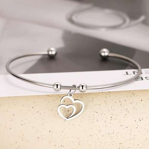 RETAIL PRICE: R 999 Adjustable Titanium "Hearts" Charm Bangle (GOLD )