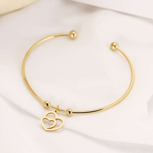 RETAIL PRICE: R 999 Adjustable Titanium "Hearts" Charm Bangle (GOLD )