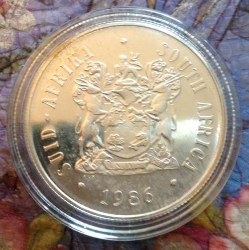 RSA Proof 1986 Johannesburg Centenary Silver One Rand in capsule
