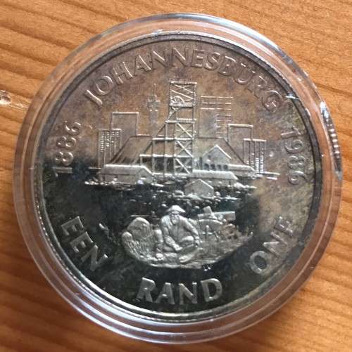 RSA Proof 1986 Johannesburg Centenary Silver One Rand in capsule