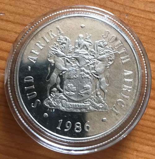 RSA Proof 1986 Johannesburg Centenary Silver One Rand in capsule