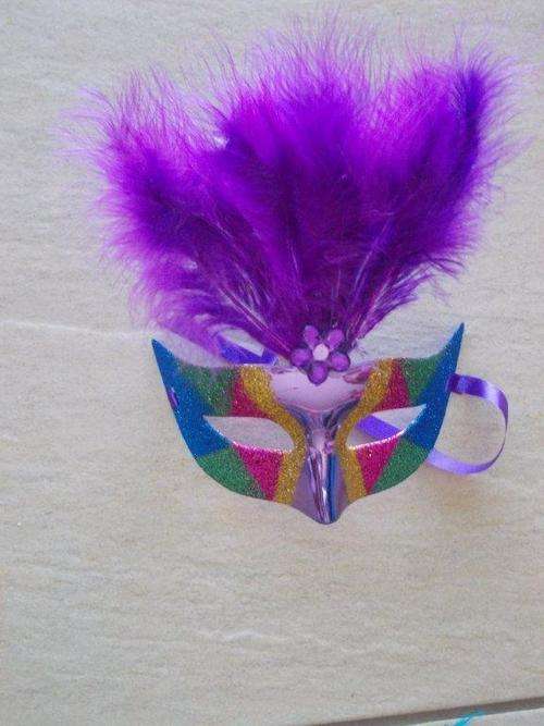 Purple mask with lights and feathers