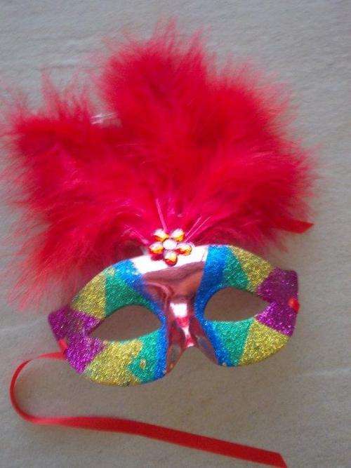 Red mask with lights and feathers