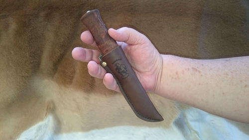Ahti Vuolu sheathed in hand