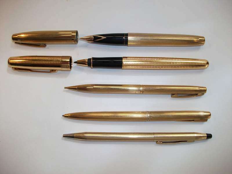 A COLLECTION OF GOLD PENS AND PENCILS
