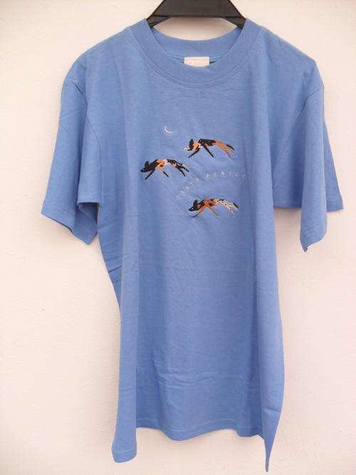 Powder blue t shirt with embroidered wild dogs