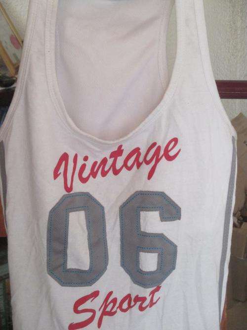 SPORTS VEST WITH BUILD IN BRA. SIZE LARGE. CONDITION VERY GOOD