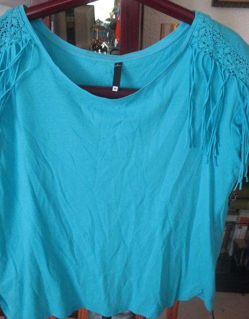 BLUE TSHIRT. WITH TASSLE DETAIL ON SHOULDERS. SIZE L. WOOLWORTHS. AS NEW