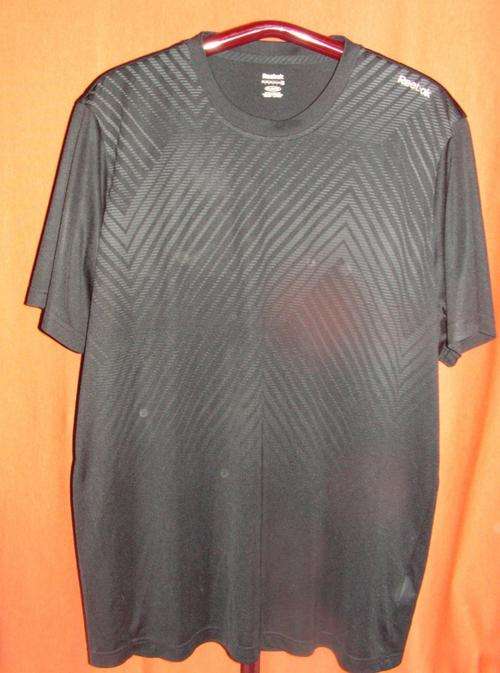 BLACK REEBOK SPORT SHIRT. SIZE EXTRA EXTRA LARGE. CONDITION: AS NEW