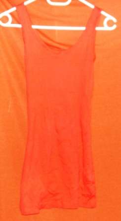 ORANGE RED RIBBED VEST T, LONGER LENTGTH. SIZE MEDIUM. CONDITION: AS NEW