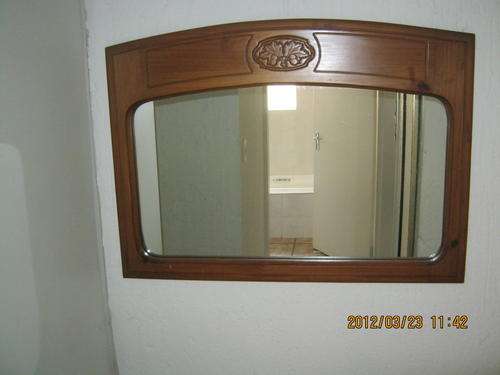 Mirror in thick wooden frame