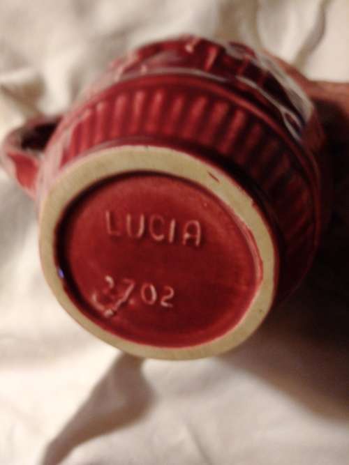 Lucia ware small Burgundy jug... 11cm  tall