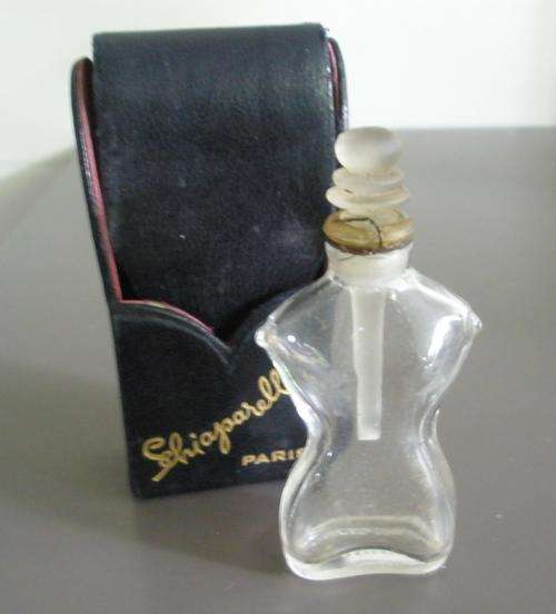 Vintage Shocking Schiaparelli miniature figural perfume bottle with black leather case
