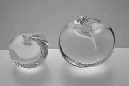 * SIMON PEARCE (IRISH-AMERICAN) TWO MAGNIFICENT PAPERWEIGHTS OF CLEAR GLASS, THE LARGER ONE SIGNED *