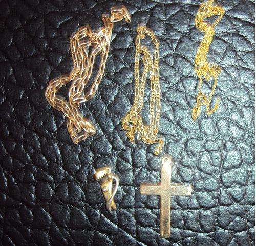 3 gold chains and cross and pendant