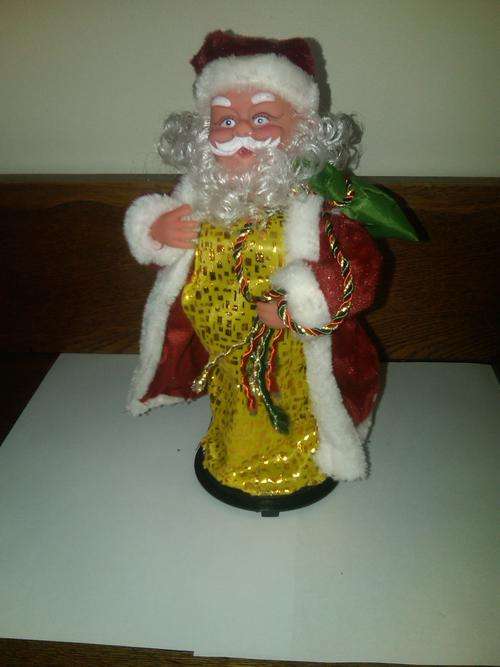 Super funny!! New!! Dancing Christmas santa claus with music and red Christmas hat!!
