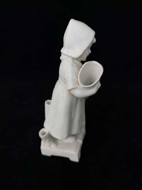 Biscuit porcelain figurine of girl