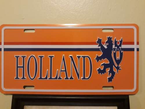 A Holland Plaque (Metal) and an Amsterdam Picture in Frame