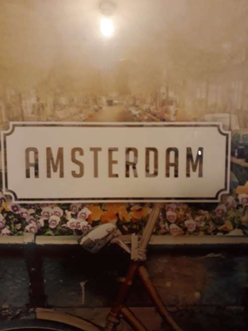 A Holland Plaque (Metal) and an Amsterdam Picture in Frame