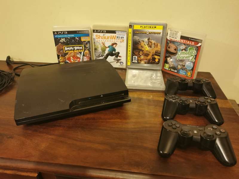 Sony PlayStation 3 Console with 3 Remotes and a Few Games