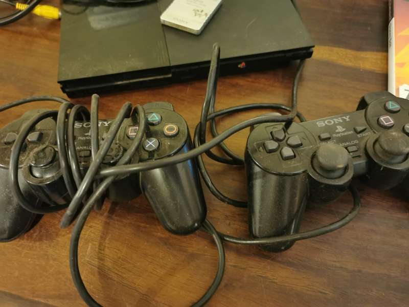 Complete PlayStation 2 Console with Memory Card and 9 Games
