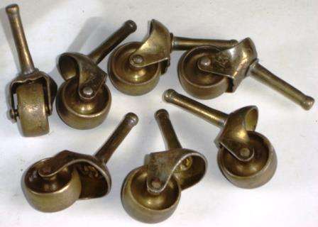 A Lot of 7 Antique Brass Furniture Casters