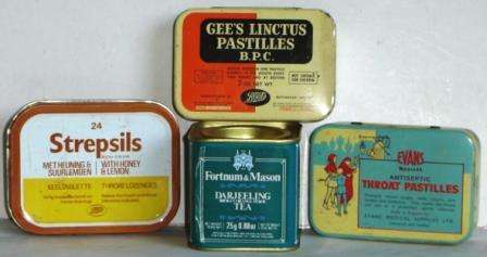 A group of four Vintage Tins.   Three for tablets, one tea tin.