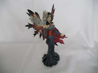 Fairy holding owl -  wearing red cape