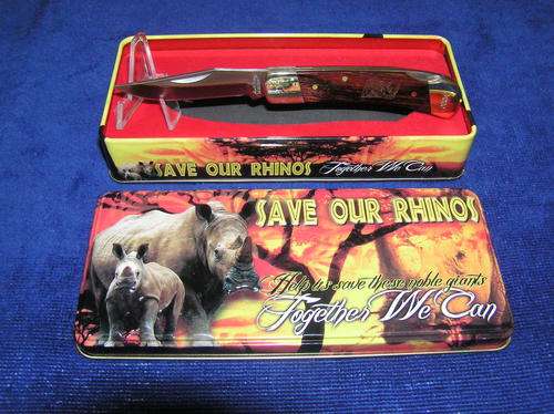 Save Our Rhinos tin with knife